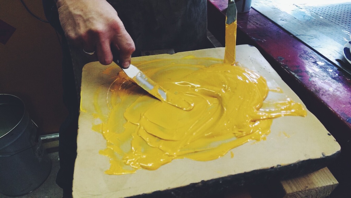 Ceramic colour being mixed by hand