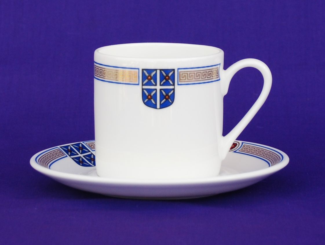 Coffee cup and saucer printed with a crest and patterned band