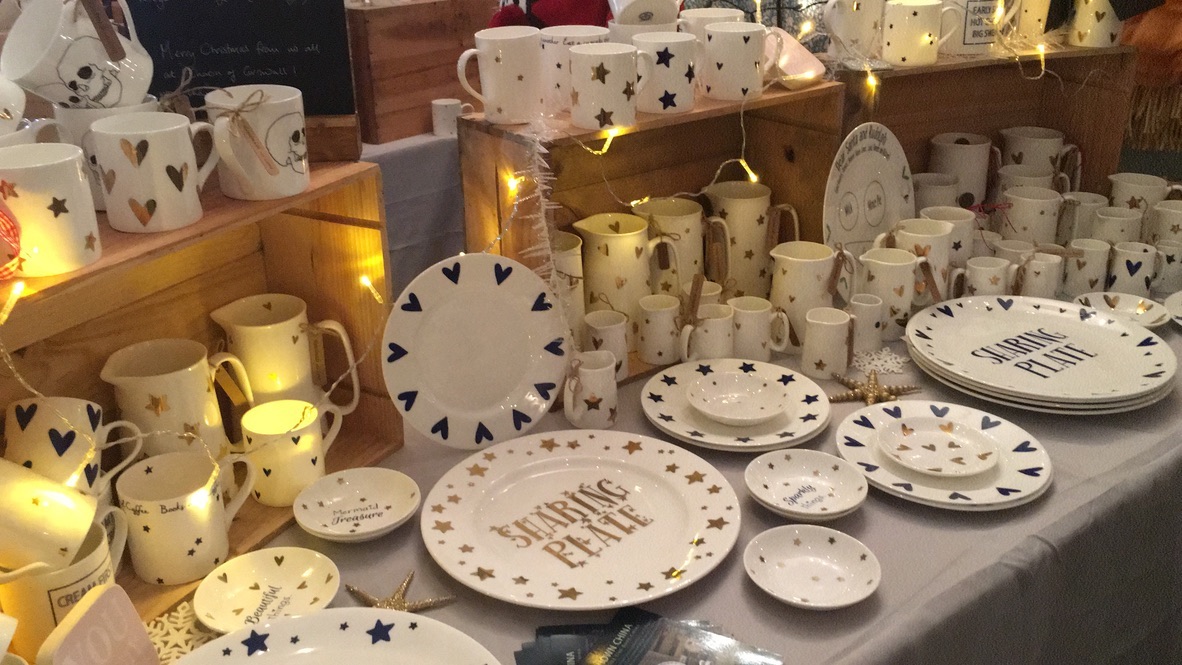 Display of hand-printed mugs, plates and jugs