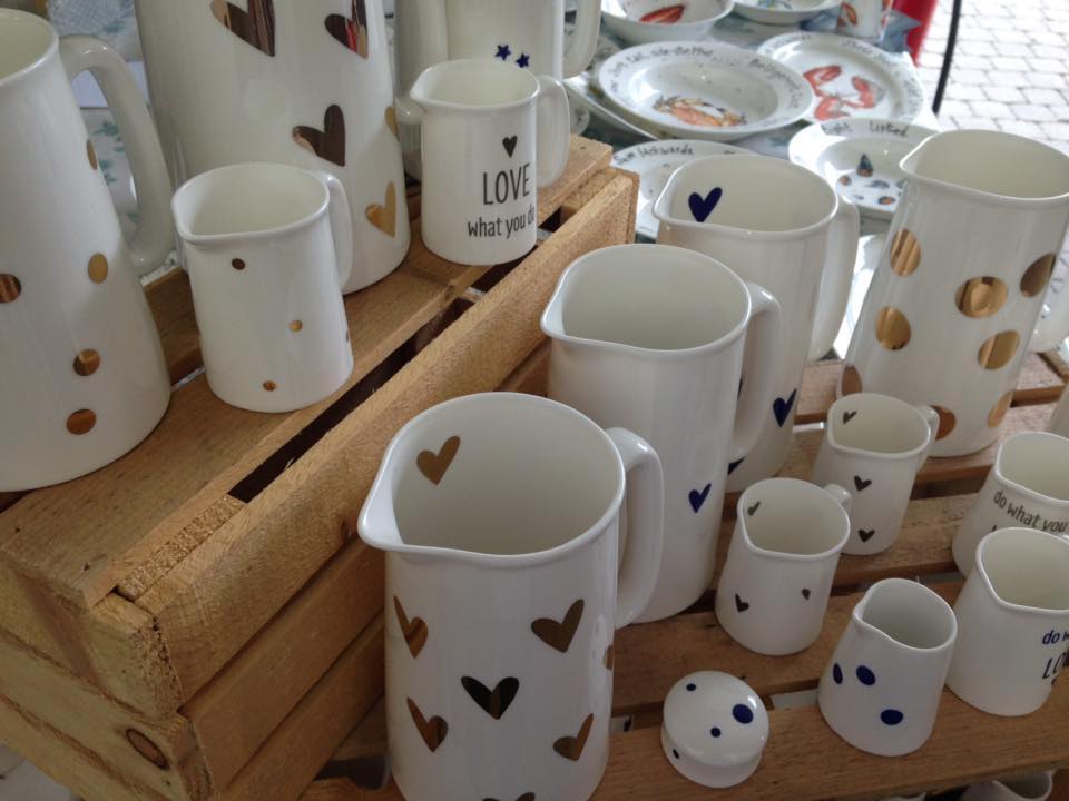 Display of hand-printed jugs, mugs and a teapot