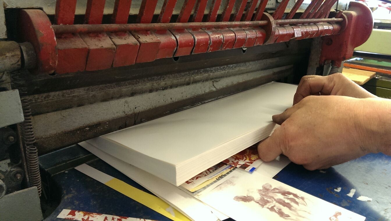 Transfer sheets being cut on a guillotine