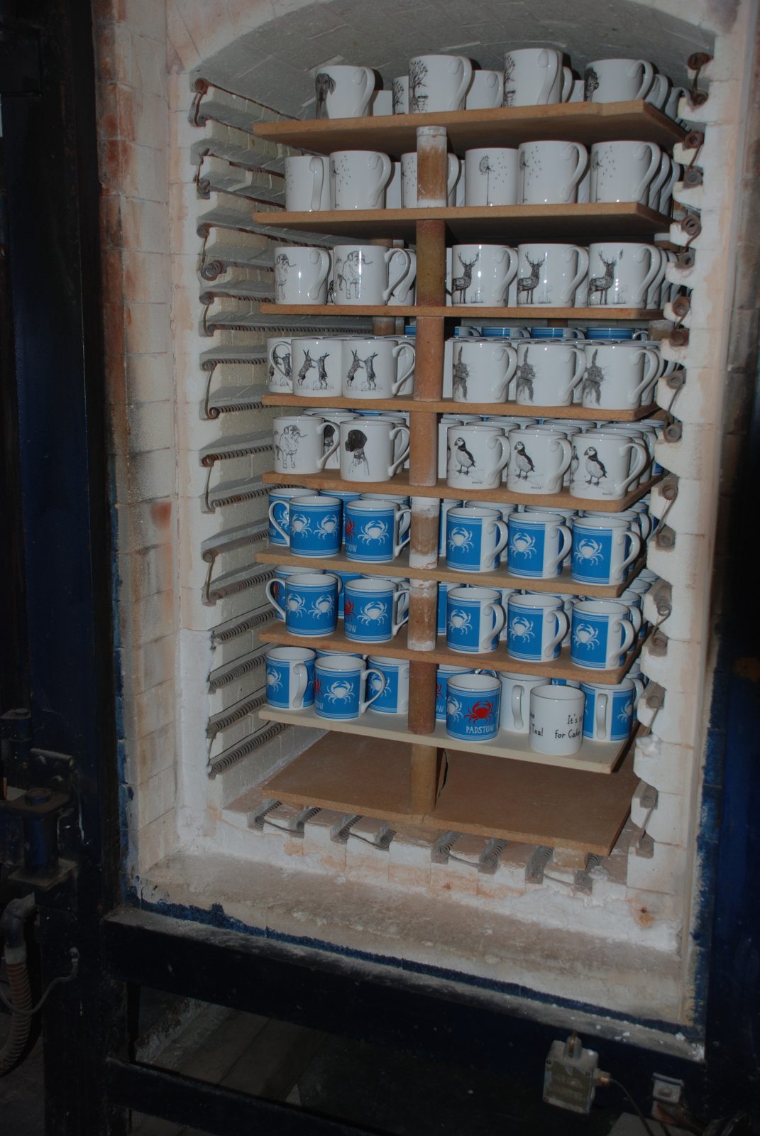 Kiln loaded with printed mugs